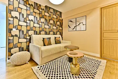 Coin salon dans l'établissement Appartement 3 chambres proche Châtelet-Les Halles