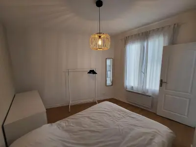 Un ou plusieurs lits dans un hébergement de l'établissement Appartement T2 spacieux de 30m2, idéal proche Paris