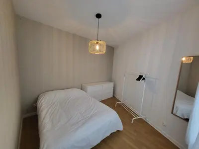 Un ou plusieurs lits dans un hébergement de l'établissement Appartement T2 spacieux de 30m2, idéal proche Paris