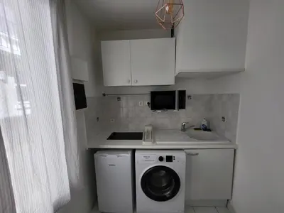 Cuisine ou kitchenette dans l'établissement Appartement T2 spacieux de 30m2, idéal proche Paris