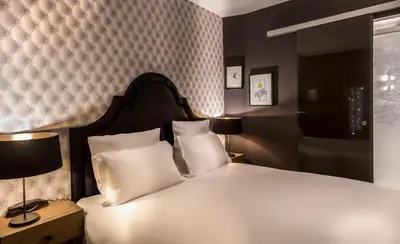 Un ou plusieurs lits dans un hébergement de l'établissement Hôtel La Parizienne - Proche Montparnasse