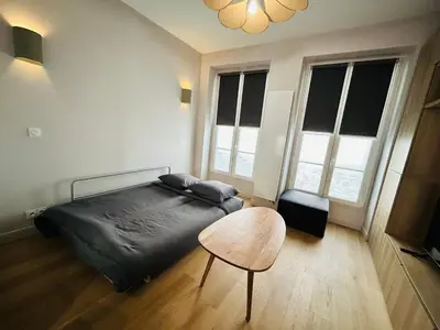 Un ou plusieurs lits dans un hébergement de l'établissement Enghien - New studio fully furnished