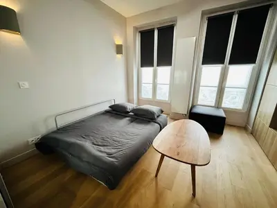 Un ou plusieurs lits dans un hébergement de l'établissement Enghien - New studio fully furnished