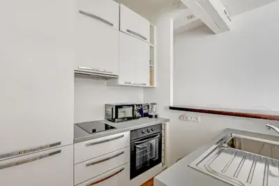 Cuisine ou kitchenette dans l'établissement Pick A Flat's Apartment in Saint Germain - Rue de Buci