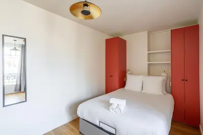 Un ou plusieurs lits dans un hébergement de l'établissement The Paris 15 Place