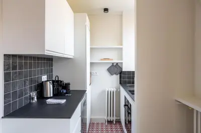 Cuisine ou kitchenette dans l'établissement The Paris 15 Place