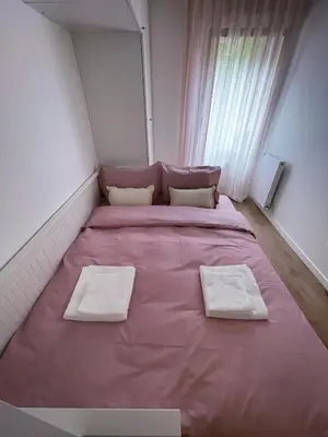 Un ou plusieurs lits dans un hébergement de l'établissement Grand appartement
