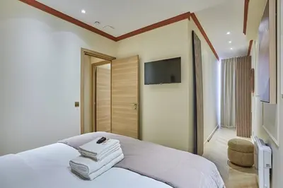 Un ou plusieurs lits dans un hébergement de l'établissement Apartment 3 bedrooms Center of Paris by Studio Prestige