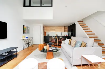 Télévision ou salle de divertissement dans l'établissement Amazing Loft 2BR - Eiffel Tower