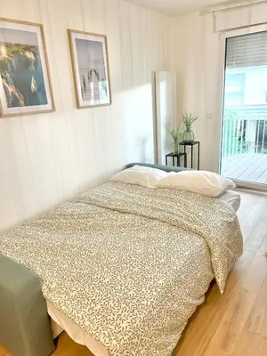 Un ou plusieurs lits dans un hébergement de l'établissement Appartement moderne & spacieux avec parking Paris