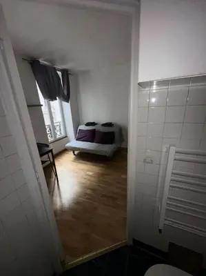 Un ou plusieurs lits dans un hébergement de l'établissement Central Studio Paris 1C