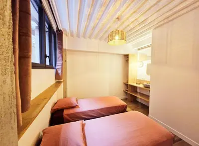 Un ou plusieurs lits dans un hébergement de l'établissement Maison Juliette