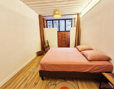 Un ou plusieurs lits dans un hébergement de l'établissement Maison Juliette