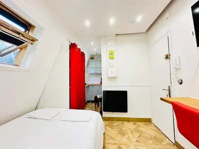 Un ou plusieurs lits dans un hébergement de l'établissement Pretty Central flat in Paris