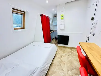 Un ou plusieurs lits dans un hébergement de l'établissement Pretty Central flat in Paris