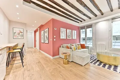 Coin salon dans l'établissement Appartement 3 chambres Paris Sentier
