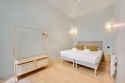 Un ou plusieurs lits dans un hébergement de l'établissement Haven of peace-2BR-4P-Near the Palais de Garnier