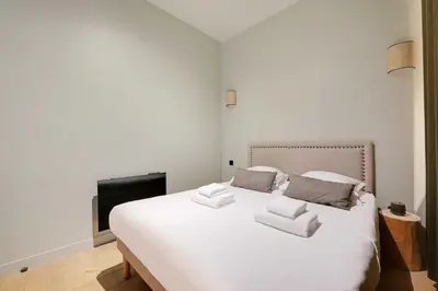 Un ou plusieurs lits dans un hébergement de l'établissement Haven of peace-2BR-4P-Near the Palais de Garnier