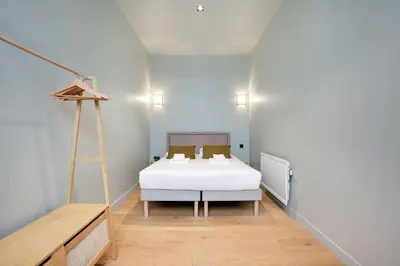 Un ou plusieurs lits dans un hébergement de l'établissement Haven of peace-2BR-4P-Near the Palais de Garnier