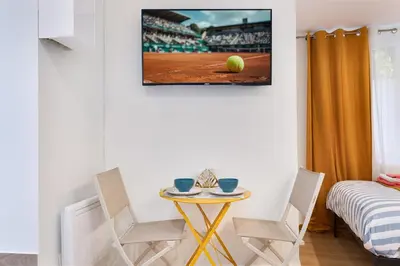 Un ou plusieurs lits dans un hébergement de l'établissement STUDIO Boulogne Roland Garros