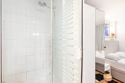 Un ou plusieurs lits dans un hébergement de l'établissement GuestReady - Cosy Nest near Place de la Bastille