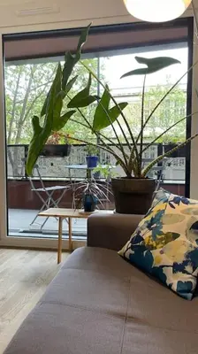 Coin salon dans l'établissement Cosy and Spacious appartement near metro line 4 & RER B