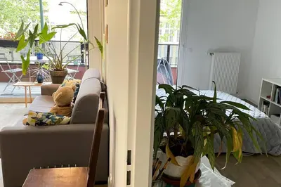 Coin salon dans l'établissement Cosy and Spacious appartement near metro line 4 & RER B
