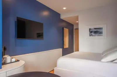 Un ou plusieurs lits dans un hébergement de l'établissement Hotel Leev Victoire & Spa