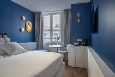 Un ou plusieurs lits dans un hébergement de l'établissement Hotel Leev Victoire & Spa