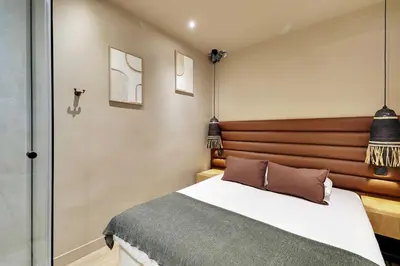 Un ou plusieurs lits dans un hébergement de l'établissement Elegant Home - 5BD-12P - Heart of 'Le Marais'
