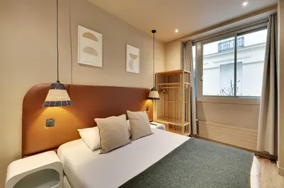 Un ou plusieurs lits dans un hébergement de l'établissement Elegant Home - 5BD-12P - Heart of 'Le Marais'
