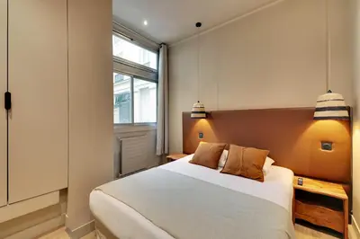 Un ou plusieurs lits dans un hébergement de l'établissement Elegant Home - 5BD-12P - Heart of 'Le Marais'