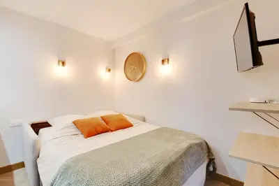 Un ou plusieurs lits dans un hébergement de l'établissement Appartement 2 personnes - Tour Eiffel