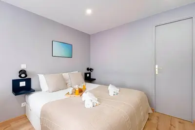 Un ou plusieurs lits dans un hébergement de l'établissement 388 Suite Trousseau - Superbe Appartement à Paris