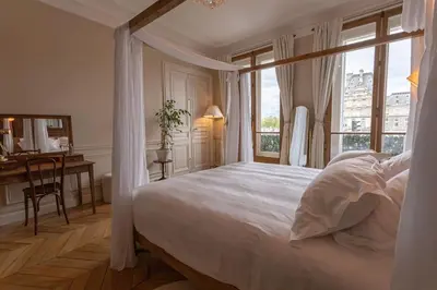 Un ou plusieurs lits dans un hébergement de l'établissement Apt vue Louvre et Seine
