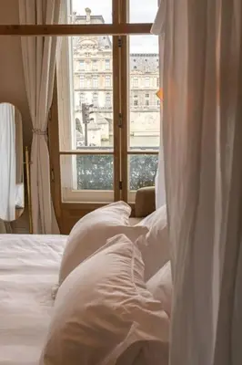 Un ou plusieurs lits dans un hébergement de l'établissement Apt vue Louvre et Seine