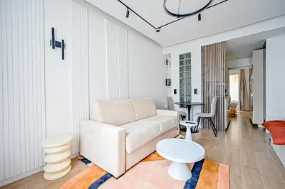 Coin salon dans l'établissement Relax in a Stylish Flat in Montmartre