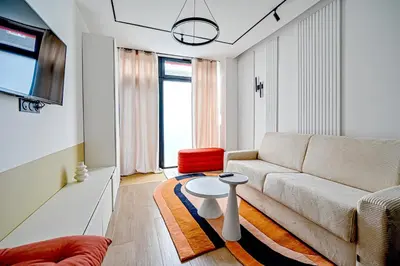 Coin salon dans l'établissement Relax in a Stylish Flat in Montmartre