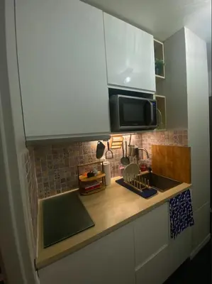 Cuisine ou kitchenette dans l'établissement Studio neuf cozy avec balcon, 11e arr Voltaire, proche Bastille