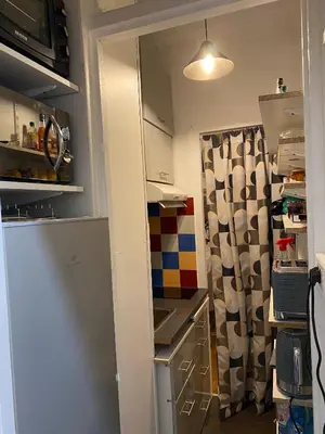 Cuisine ou kitchenette dans l'établissement Appartement Passy Tour Eiffel