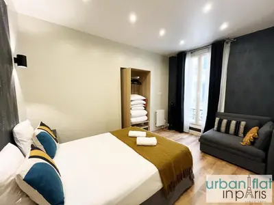 Un ou plusieurs lits dans un hébergement de l'établissement 23 - Charming Parisian Flat in Paris