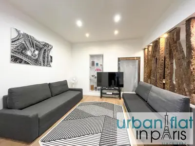 Coin salon dans l'établissement Urban Flat 52 - Charming 2 BDR Flat in Center of Paris