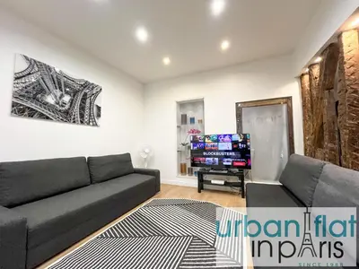 Télévision ou salle de divertissement dans l'établissement Urban Flat 52 - Charming 2 BDR Flat in Center of Paris