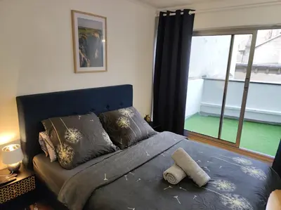 Un ou plusieurs lits dans un hébergement de l'établissement Trocadéro suite Paris 16ieme - with balcony