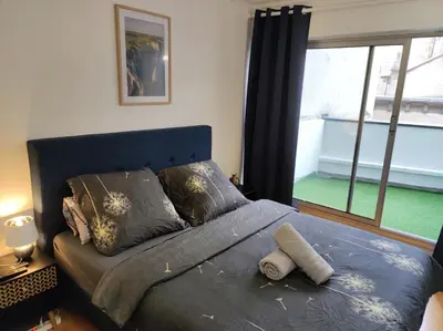 Un ou plusieurs lits dans un hébergement de l'établissement Trocadéro suite Paris 16ieme - with balcony