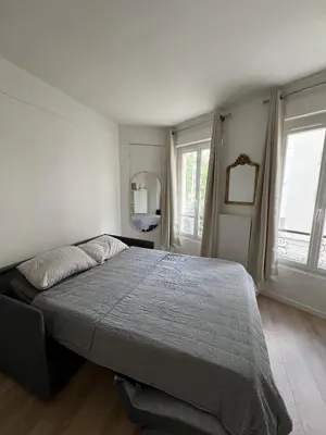 Un ou plusieurs lits dans un hébergement de l'établissement Stylish apartment in Paris