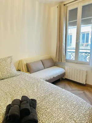 Un ou plusieurs lits dans un hébergement de l'établissement artist flat 450m to Mont Martre