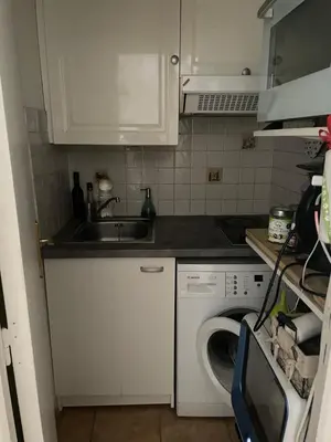 Cuisine ou kitchenette dans l'établissement Cosy appartement in the heart of Paris