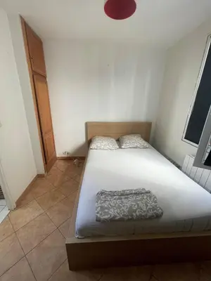Un ou plusieurs lits dans un hébergement de l'établissement Cosy appartement in the heart of Paris