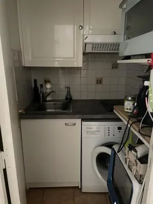 Cuisine ou kitchenette dans l'établissement Cosy appartement in the heart of Paris